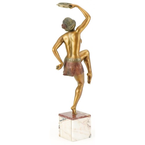 43 - Cold painted spelter figurine of an Art Deco tambourine player mounted on a marble base, 46cm high