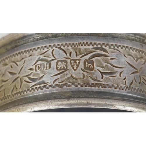 2454 - Eleven Edwardian and later silver napkin rings, some with boxes, the largest 5cm in diameter, total ... 