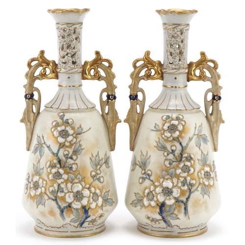 Pair of Royal Vienna porcelain vases with pierced necks, hand painted, enamelled and gilded with flowers, each numbered 5994/9105 to the base, each 26cm high