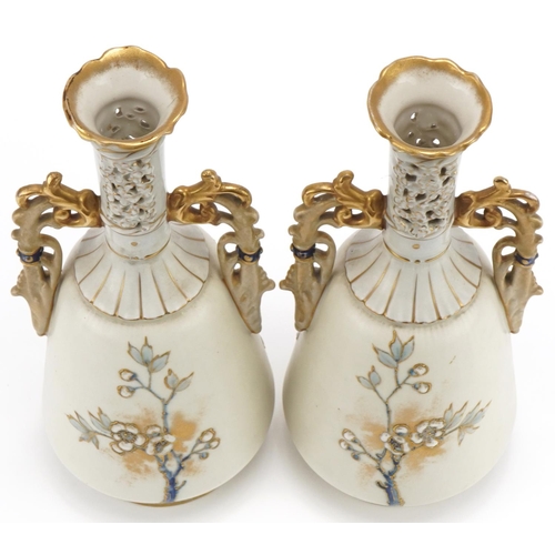 198 - Pair of Royal Vienna porcelain vases with pierced necks, hand painted, enamelled and gilded with flo... 