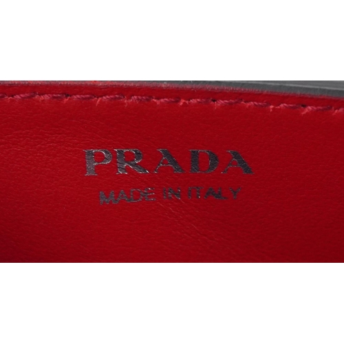 389 - Prada, ladies black and red leather Prada Elektra mini crossbody bag with box and authenticity cards... 