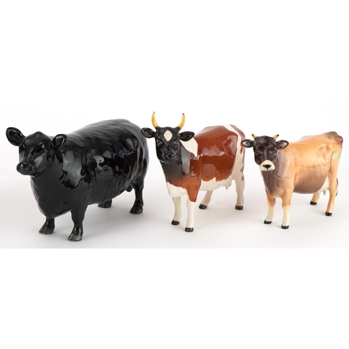 1055 - Five Beswick cows including champions, the largest 20cm in length