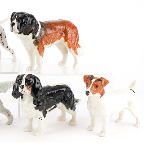 1057 - Six Beswick dogs and a Beswick fox including St Bernard's, Arnoldene and Jack Russell Terrier, the l... 