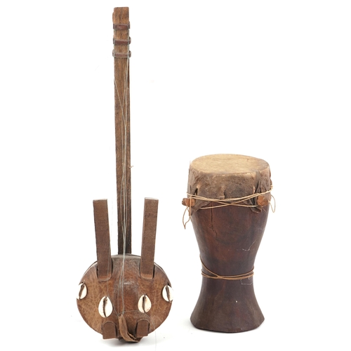 1129 - African tribal interest Krar instrument and a drum, 40cm in length