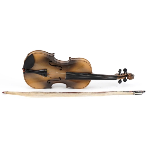 Violin with Stradivarius paper label to inside, bow and hard case, the violin back 35cm in length