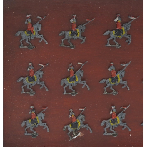 554 - Wooden cased hand painted flat lead soldiers on horseback, 33cm x 24cm