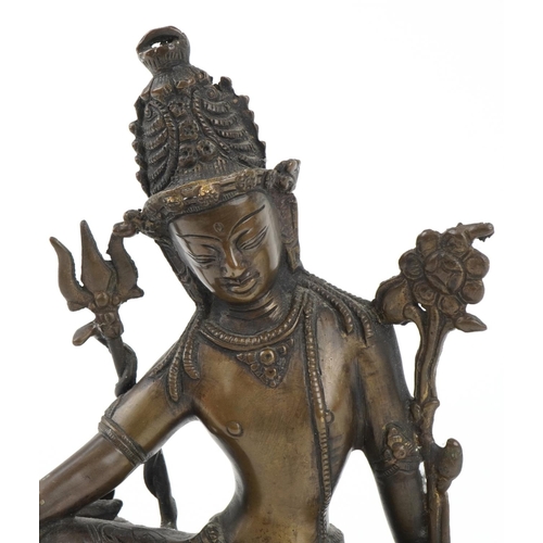 79 - Chino Tibetan bronze Buddha of Tara seated on a lion, 24cm high