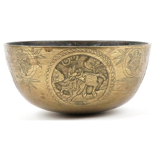 176 - Large Chinese bronze singing bowl decorated with panels of dogs of Foo, flowers and deer, character ... 