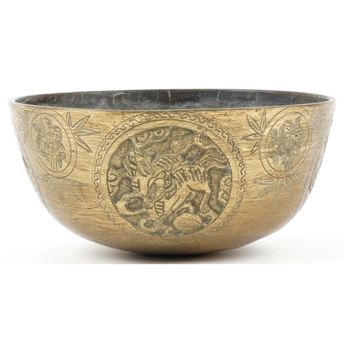 176 - Large Chinese bronze singing bowl decorated with panels of dogs of Foo, flowers and deer, character ... 