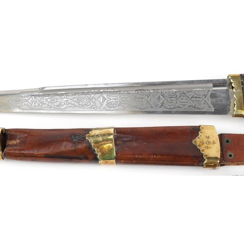 145 - Scottish piper's dirk with leather scabbard and ebony handle, 53cm in length