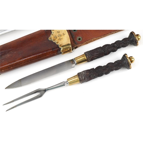 145 - Scottish piper's dirk with leather scabbard and ebony handle, 53cm in length