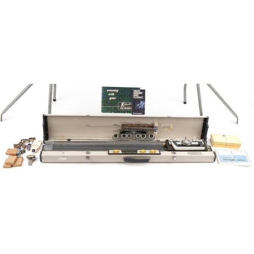 1164 - Knitmaster knitting machine on stand, model number 299638 together with a large collection of mostly... 