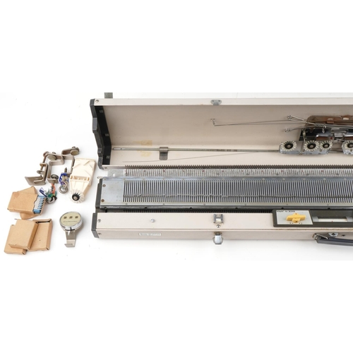 1164 - Knitmaster knitting machine on stand, model number 299638 together with a large collection of mostly... 