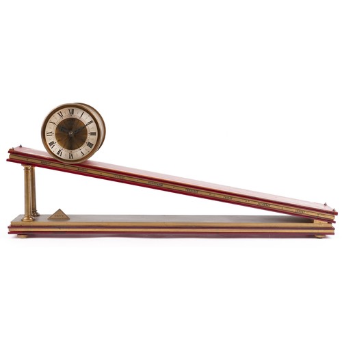 Dent of London rolling drum mystery gravity plane clock with bronze base, the base 73cm in length