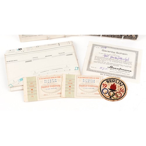 1444 - The Berlin 1936 Olympic memorabilia including Official Handbook, patch badge, tickets for 12th Augus... 