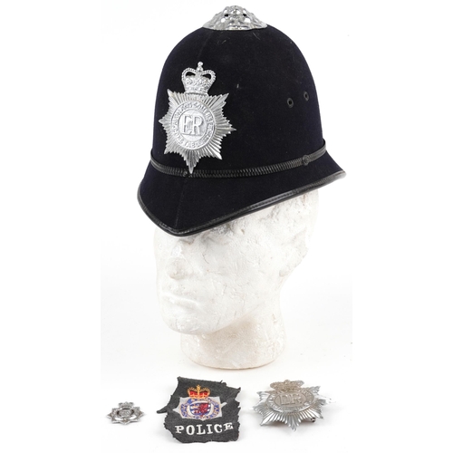 1337A - Avon & Somerset Constabulary policeman's helmet with two badges and cloth patch