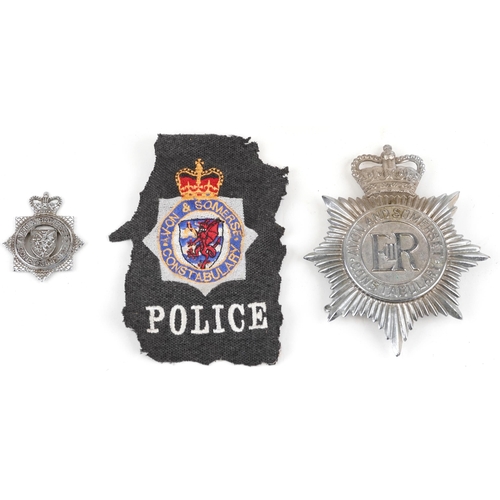 1337A - Avon & Somerset Constabulary policeman's helmet with two badges and cloth patch