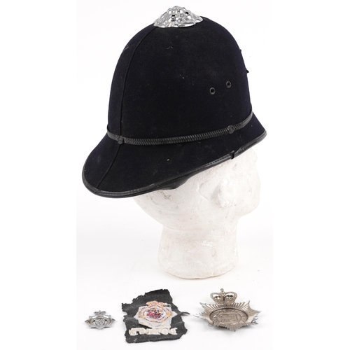 1337A - Avon & Somerset Constabulary policeman's helmet with two badges and cloth patch