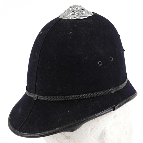 1337A - Avon & Somerset Constabulary policeman's helmet with two badges and cloth patch