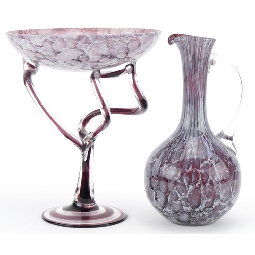 1176 - 20th century purple art glass tazza together with a similar art glass jug, the largest 27cm high