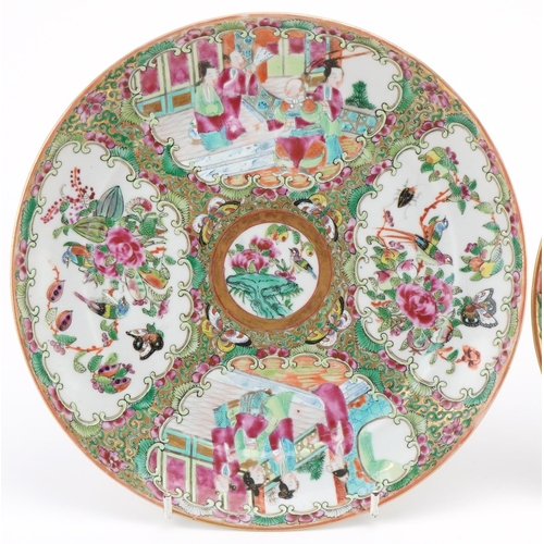 163 - Two Chinese famille rose plates decorated with courtier scenes and panels of flowers and birds, the ... 