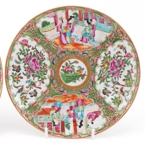 163 - Two Chinese famille rose plates decorated with courtier scenes and panels of flowers and birds, the ... 