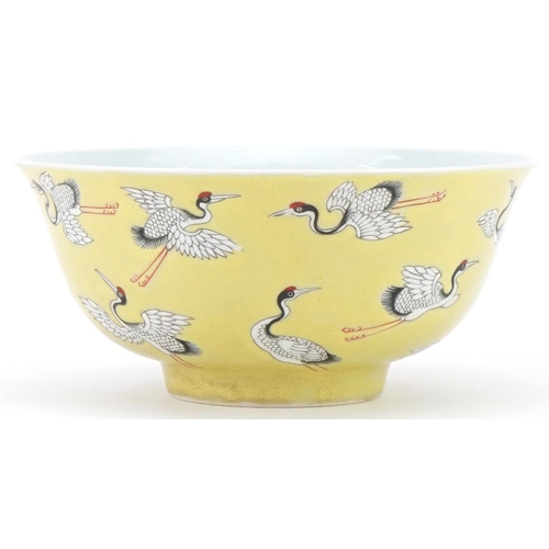 353 - Chinese porcelain yellow ground bowl hand painted and enamelled with flying cranes, character mark t... 