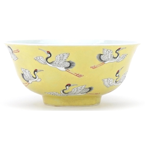 353 - Chinese porcelain yellow ground bowl hand painted and enamelled with flying cranes, character mark t... 