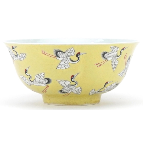 353 - Chinese porcelain yellow ground bowl hand painted and enamelled with flying cranes, character mark t... 