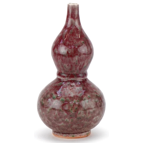 426 - Chinese porcelain sang de boeuf glazed onion shaped vase, 22cm high