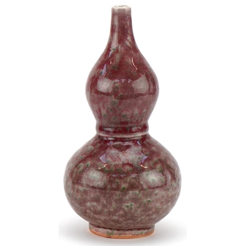 426 - Chinese porcelain sang de boeuf glazed onion shaped vase, 22cm high