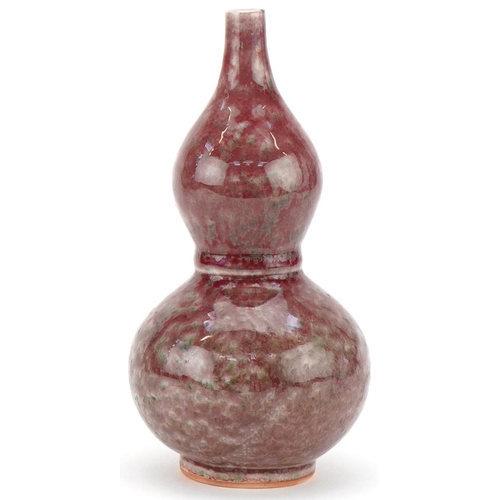 426 - Chinese porcelain sang de boeuf glazed onion shaped vase, 22cm high