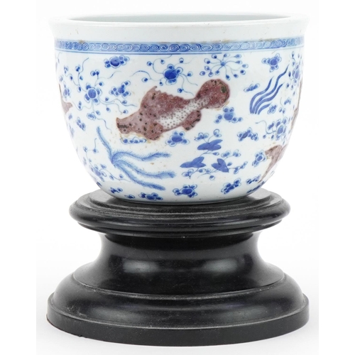 285 - Chinese porcelain jardinière decorated with fish, mounted on a wooden stand, character mark to the b... 