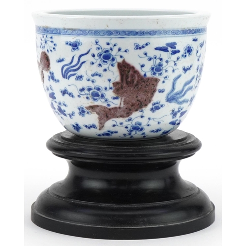 285 - Chinese porcelain jardinière decorated with fish, mounted on a wooden stand, character mark to the b... 