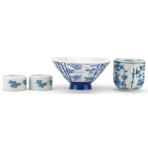 421 - Oriental porcelain blue and white rice bowl, ginger jar covers and a cup, the largest 12cm in diamet... 