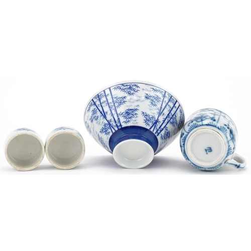 421 - Oriental porcelain blue and white rice bowl, ginger jar covers and a cup, the largest 12cm in diamet... 