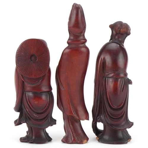 81 - Three Chinese carved wood figures including a Buddha, the largest 14cm high