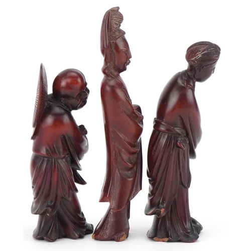 81 - Three Chinese carved wood figures including a Buddha, the largest 14cm high