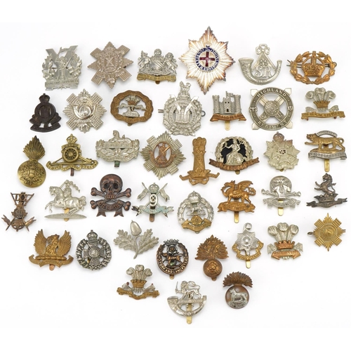 1520 - Approximately forty cap badges to include Highland Regiment, Scottish King's Borderers, The Royal Sc... 