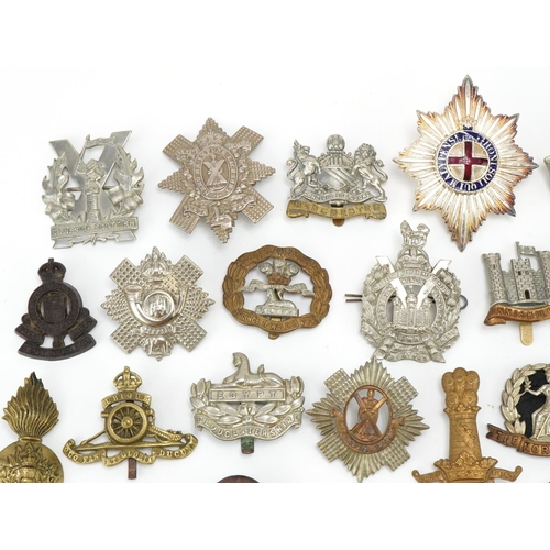 1520 - Approximately forty cap badges to include Highland Regiment, Scottish King's Borderers, The Royal Sc... 