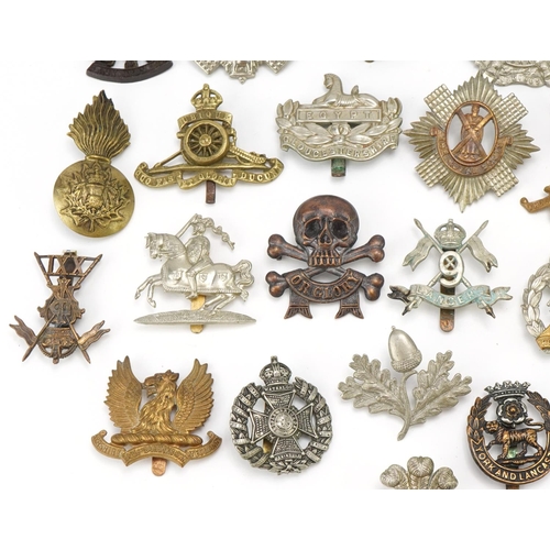 1520 - Approximately forty cap badges to include Highland Regiment, Scottish King's Borderers, The Royal Sc... 