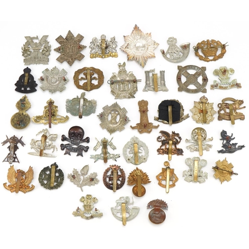 1520 - Approximately forty cap badges to include Highland Regiment, Scottish King's Borderers, The Royal Sc... 