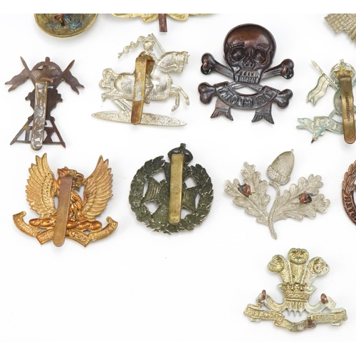 1520 - Approximately forty cap badges to include Highland Regiment, Scottish King's Borderers, The Royal Sc... 