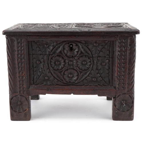 134 - Miniature antique carved oak coffer, possibly a traveller's sample, 20cm H x 30cm W x 16cm D