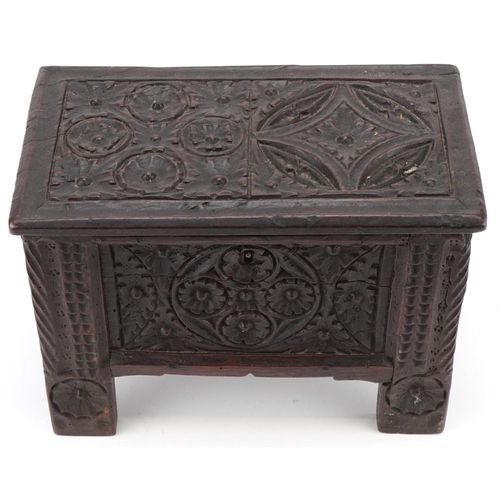 134 - Miniature antique carved oak coffer, possibly a traveller's sample, 20cm H x 30cm W x 16cm D