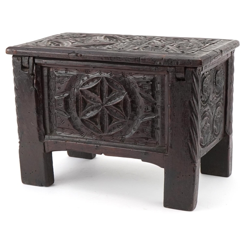 134 - Miniature antique carved oak coffer, possibly a traveller's sample, 20cm H x 30cm W x 16cm D