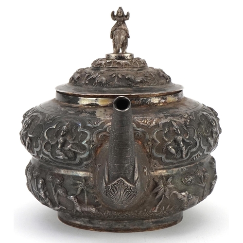 117 - Indian unmarked silver teapot with elephant head handle and spout profusely embosses with wild anima... 