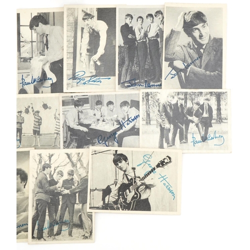 505 - The Beatles black and white photographic cards together with a small brass backed Beatles book, the ... 