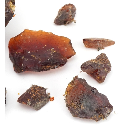 318 - Large block and fragments of natural amber, 15cm wide, total weight 1412g