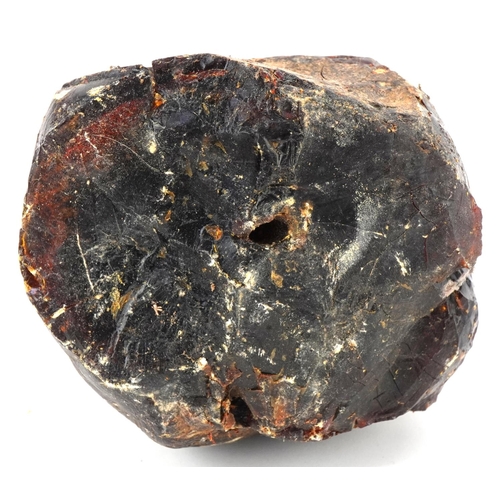 318 - Large block and fragments of natural amber, 15cm wide, total weight 1412g